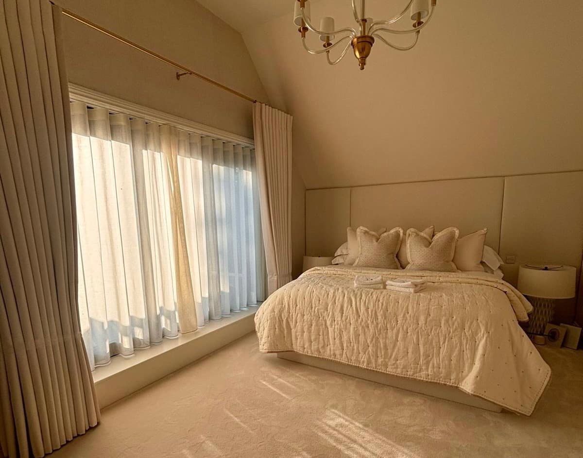 Motorised window treatments integrated into a finished interior