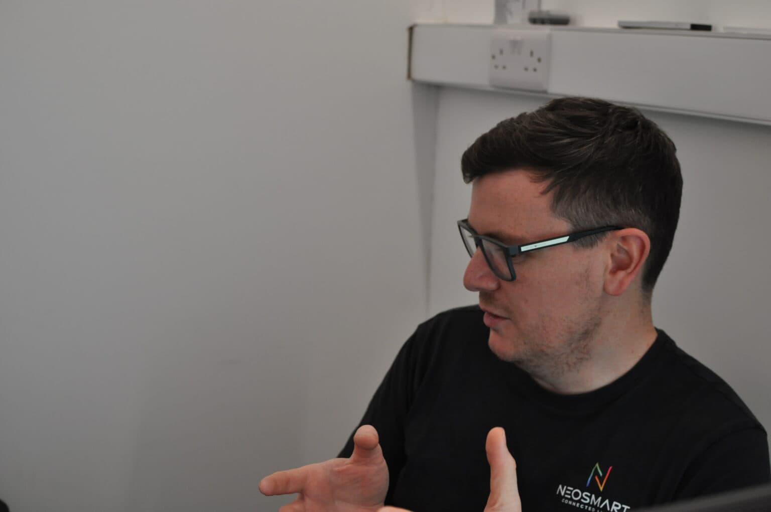 A Neosmart consultant discussing a home technology design